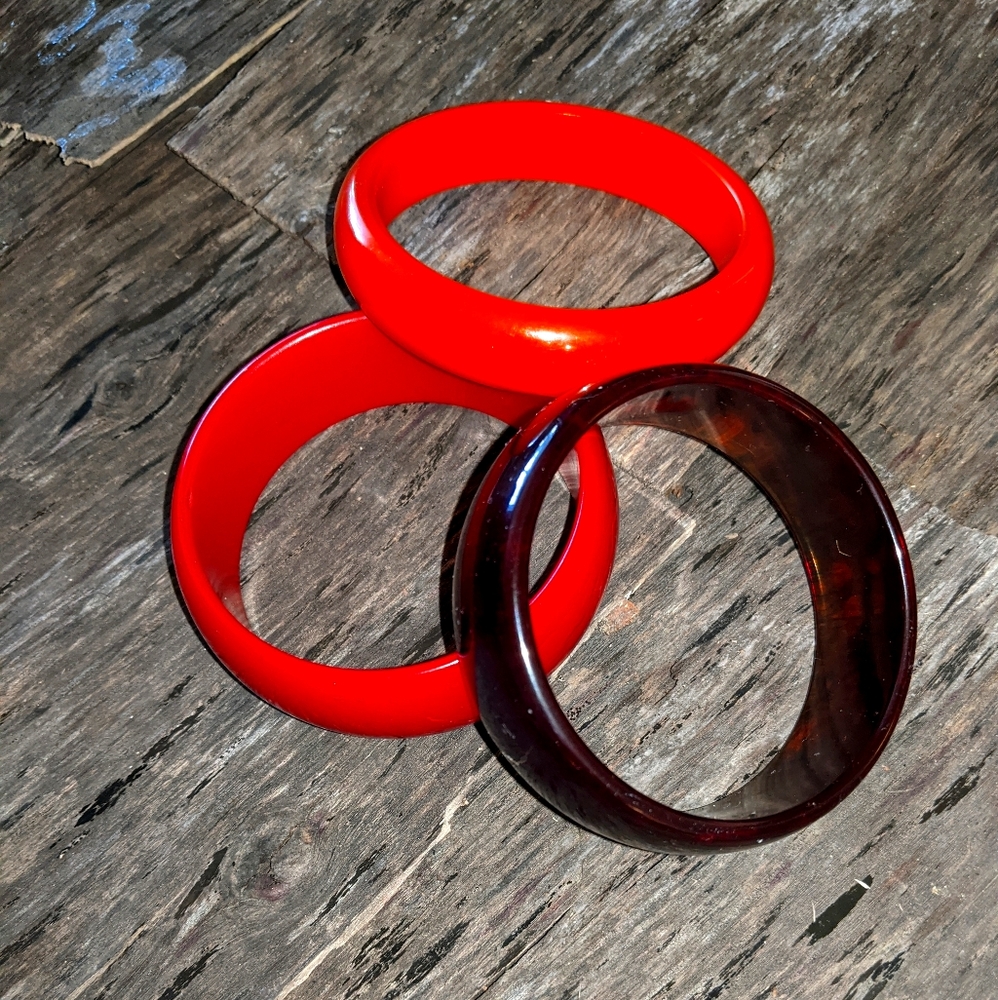 Three plastic bracelets.